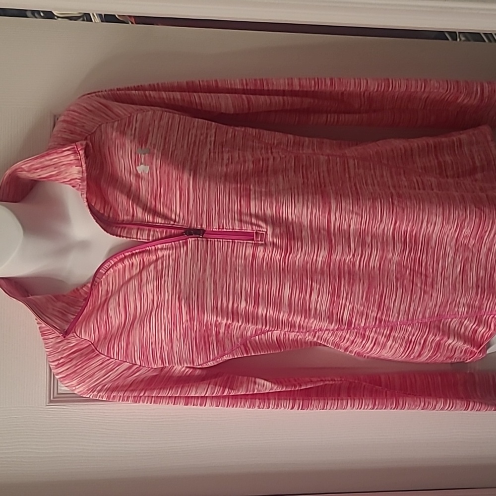 Ladies under armor pink and white 3/4 zip jacket.